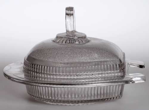 Sowerby lidded butter dish in the shape of a horse shoe
